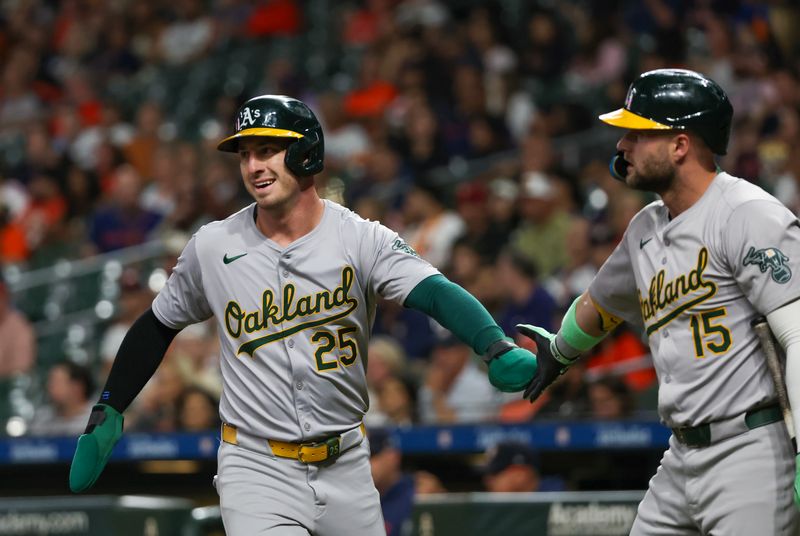 Sep 10, 2024; Houston, Texas, USA; Oakland Athletics right fielder Seth Brown (15) celebrates designated hitter Brent Rooker (25) run against the Houston Astros  in the first inning at Minute Maid Park. Mandatory Credit: Thomas Shea-Imagn Images