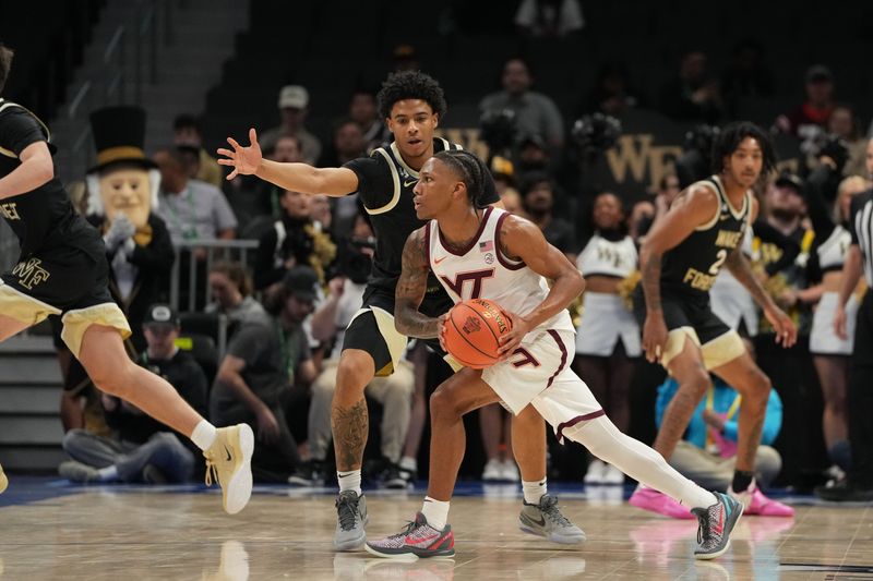 Mar 10, 2026; Charlotte, NC, USA; Virginia Tech Hokies guard Ben Hammond (3) looks to pass as Wake Forest Demon Deacons guard Myles Colvin (6) defends in the first half at Spectrum Center. Mandatory Credit: Bob Donnan-Imagn Images