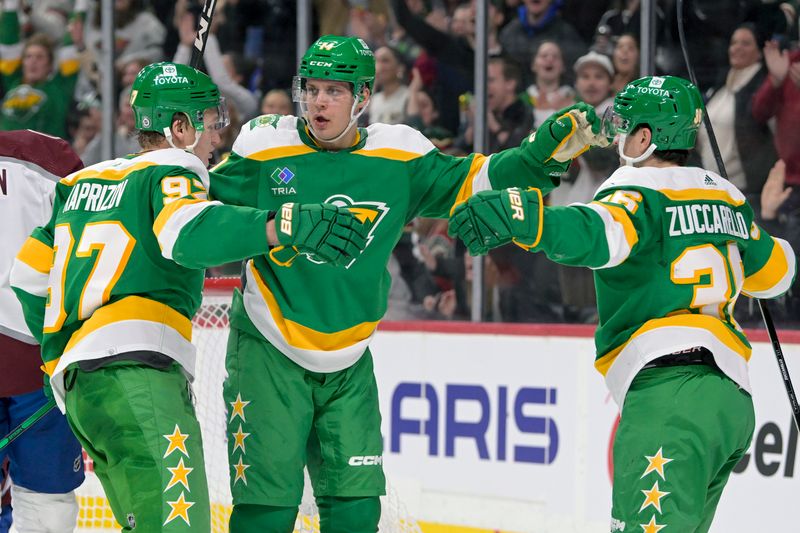 Nov 24, 2023; Saint Paul, Minnesota, USA; Minnesota Wild forward Joel Eriksson Ek (14) celebrates his power play goal against the Colorado Avalanche with forward Kirill Kaprizov (97) and forward Mats Zuccarello (36) during the second period at Xcel Energy Center. Mandatory Credit: Nick Wosika-USA TODAY Sports