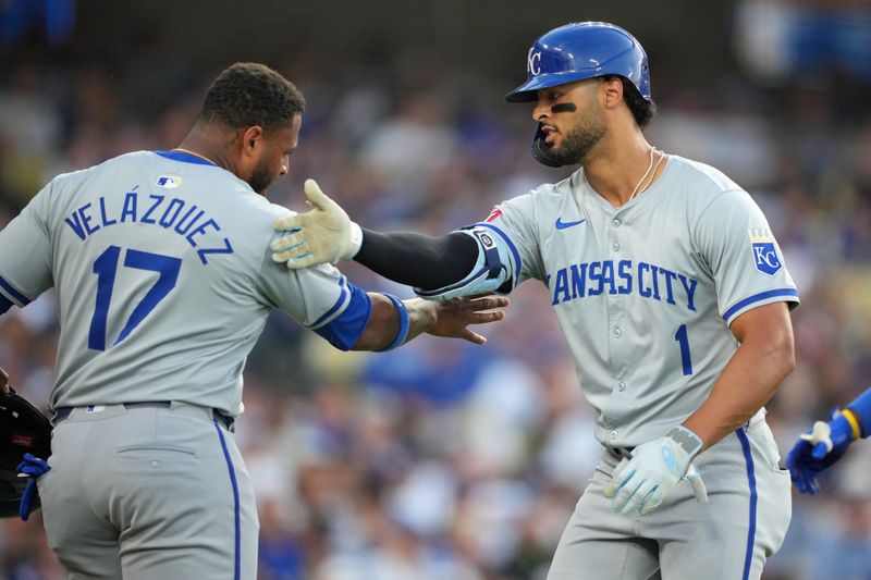 Jun 15, 2024; Los Angeles, California, USA; Kansas City Royals left fielder MJ Melendez (1) celebrates with designated hitter Nelson Velazquez (17) after hitting a grand slam home run in the sixth inning against the Los Angeles Dodgers at Dodger Stadium. Mandatory Credit: Kirby Lee-USA TODAY Sports