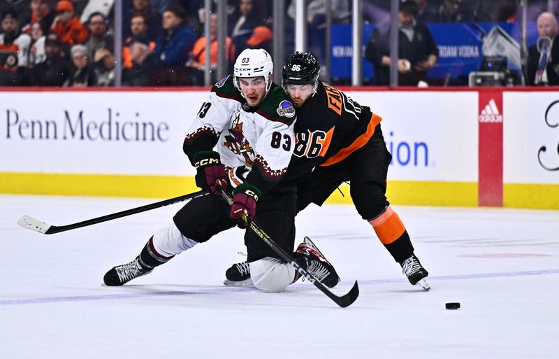 Feb 12, 2024; Philadelphia, Pennsylvania, USA; Arizona Coyotes center Adam Ruzicka (83) battles for the puck against Philadelphia Flyers left wing Joel Farabee (86) in the first period at Wells Fargo Center. Mandatory Credit: Kyle Ross-USA TODAY Sports