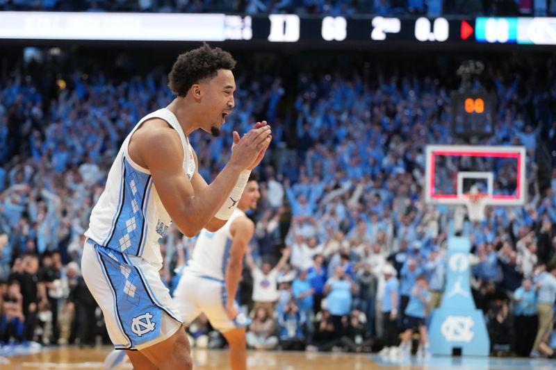 Feb 7, 2026; Chapel Hill, North Carolina, USA; North Carolina Tar Heels guard Seth Trimble (7) and teammates react after hitting the game winning shot in the second  half at Dean E. Smith Center. Mandatory Credit: Bob Donnan-Imagn Images