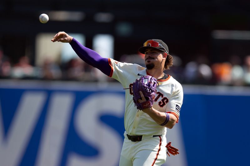 Sep 27, 2025; San Francisco, California, USA; San Francisco Giants shortstop Willy Adames (2) warms up before a game against the Colorado Rockies at Oracle Park. Mandatory Credit: D. Ross Cameron-Imagn Images