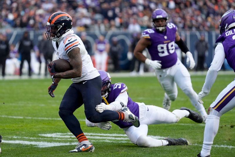 Chicago Bears wide receiver DJ Moore (2) runs past a Minnesota Vikings defender to score a touchdown during the second half of an NFL football game Sunday, Nov. 24, 2024, in Chicago. (AP Photo/Erin Hooley)