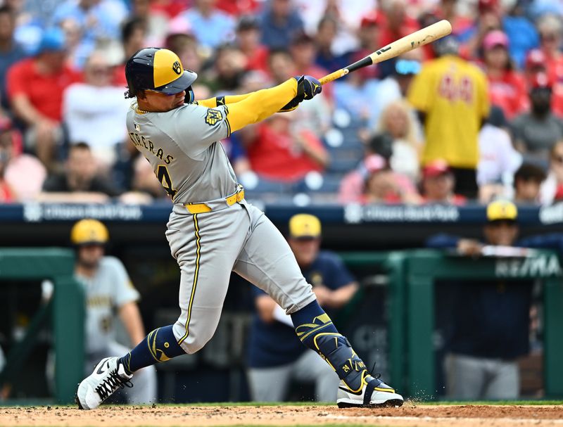 Jun 5, 2024; Philadelphia, Pennsylvania, USA; Milwaukee Brewers catcher William Contreras (24) hits a double against the Philadelphia Phillies in the seventh inning at Citizens Bank Park. Mandatory Credit: Kyle Ross-USA TODAY Sports