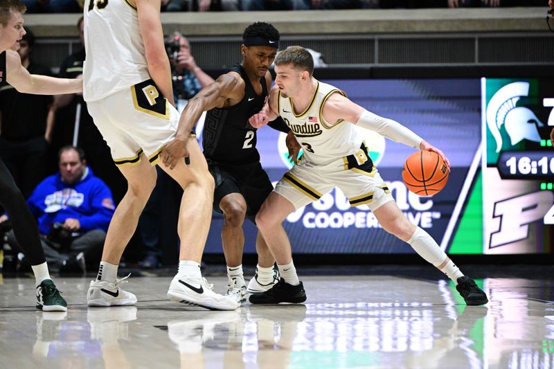 Mar 2, 2024; West Lafayette, Indiana, USA; Purdue Boilermakers guard Braden Smith (3) leans into Michigan State Spartans guard Tyson Walker (2) during the first half at Mackey Arena. Mandatory Credit: Marc Lebryk-USA TODAY Sports