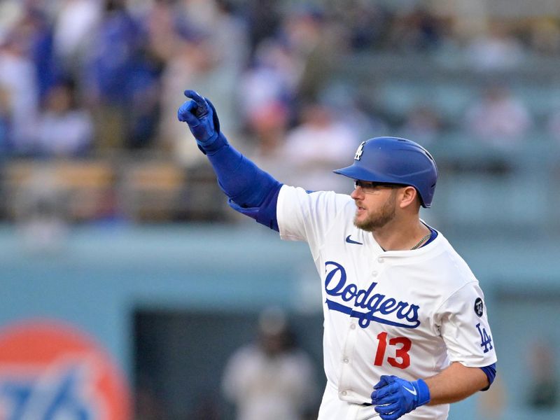 May 15, 2025; Los Angeles, California, USA; Los Angeles Dodgers third baseman Max Muncy (13) celebrates as he rounds the bases after hitting a two-run home run against the Athletics during the first inning of the game at Dodger Stadium. Mandatory Credit: Jayne Kamin-Oncea-Imagn Images