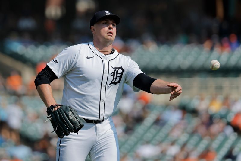 Sep 12, 2024; Detroit, Michigan, USA;  Detroit Tigers pitcher Tarik Skubal (29) underhands the ball to first in the fifth inning against the Colorado Rockies at Comerica Park. Mandatory Credit: Rick Osentoski-Imagn Images