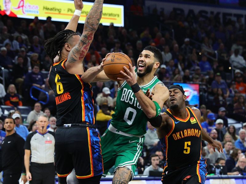 OKLAHOMA CITY, OK - JANUARY 5:  Jayson Tatum #0 of the Boston Celtics drives to the basket during the game against the Oklahoma City Thunder on January 5, 2025 at Paycom Center in Oklahoma City, Oklahoma. NOTE TO USER: User expressly acknowledges and agrees that, by downloading and or using this photograph, User is consenting to the terms and conditions of the Getty Images License Agreement. Mandatory Copyright Notice: Copyright 2025 NBAE (Photo by Martin McGrew/NBAE via Getty Images)