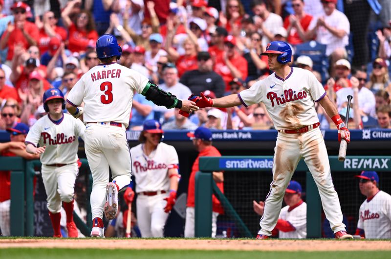 May 7, 2023; Philadelphia, Pennsylvania, USA; Philadelphia Phillies designated hitter Bryce Harper (3) celebrates with catcher J.T. Realmuto (10) after scoring against the Boston Red Sox in the fourth inning at Citizens Bank Park. Mandatory Credit: Kyle Ross-USA TODAY Sports