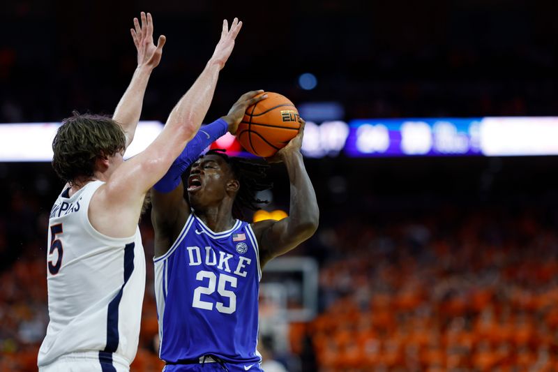 Feb 11, 2023; Charlottesville, Virginia, USA; Duke Blue Devils forward Mark Mitchell (25) holds the ball as Virginia Cavaliers forward Ben Vander Plas (5) defends in the first half at John Paul Jones Arena. Mandatory Credit: Geoff Burke-USA TODAY Sports