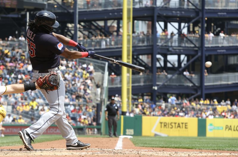 Jul 19, 2023; Pittsburgh, Pennsylvania, USA;  Cleveland Guardians first baseman Josh Bell (55) hits an RBI single against the Pittsburgh Pirates during the fifth inning at PNC Park. Mandatory Credit: Charles LeClaire-USA TODAY Sports