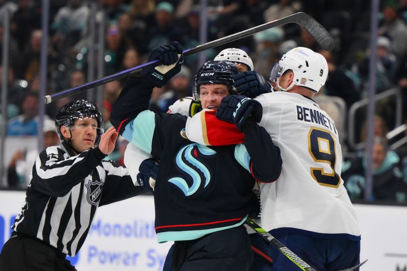 Dec 12, 2023; Seattle, Washington, USA; Florida Panthers center Sam Bennett (9) holds Seattle Kraken defenseman Will Borgen (3) during the third period at Climate Pledge Arena. Mandatory Credit: Steven Bisig-USA TODAY Sports