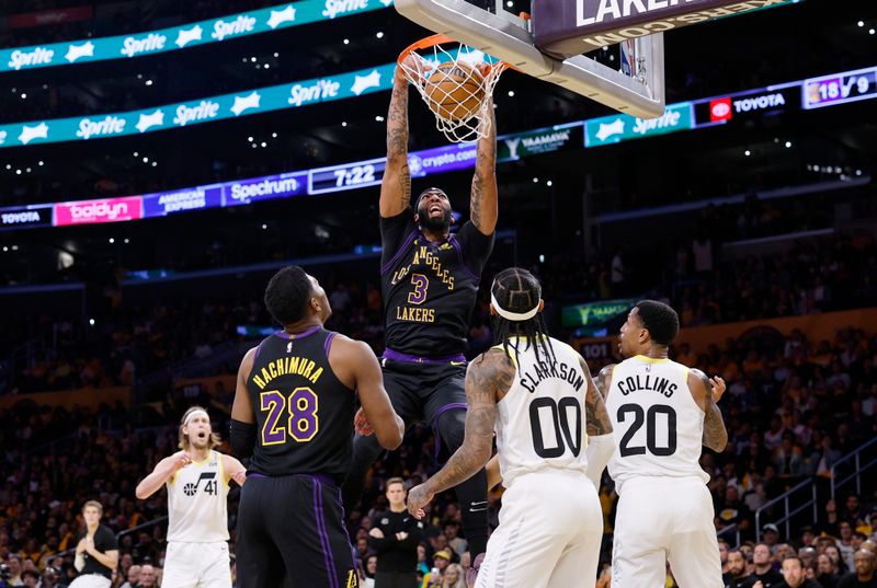 LOS ANGELES, CALIFORNIA - NOVEMBER 21: Anthony Davis #3 of the Los Angeles Lakers scores a basket against Jordan Clarkson #00 and John Collins #20 of the Utah Jazz with teammate Rui Hachimura #28 of the Los Angeles Lakers looking on during the first half of an NBA In-Season Tournament game at Crypto.com Arena on November 21, 2023 in Los Angeles, California. NOTE TO USER: User expressly acknowledges and agrees that, by downloading and or using this photograph, User is consenting to the terms and conditions of the Getty Images License Agreement. (Photo by Kevork Djansezian/Getty Images)