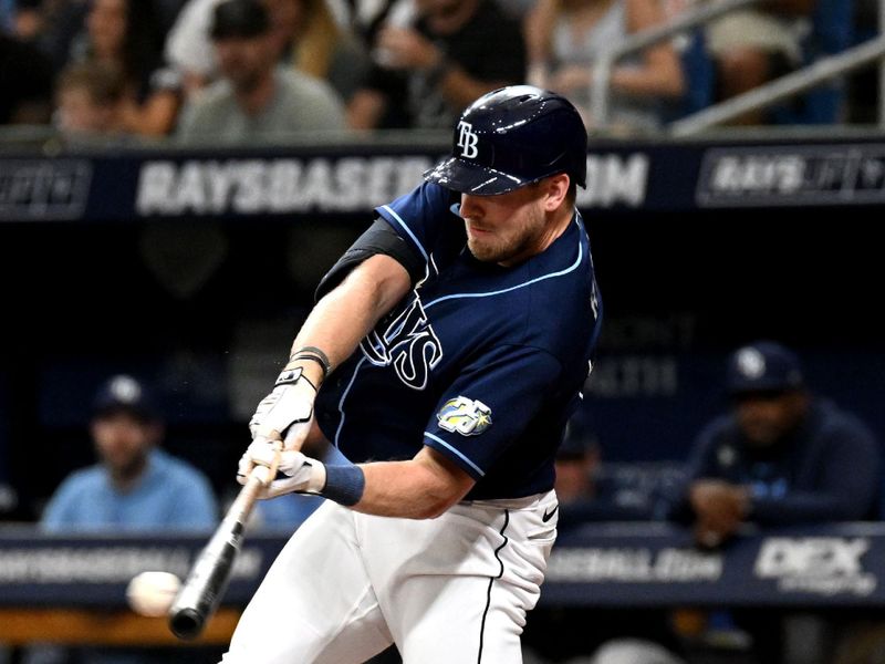 Aug 26, 2023; St. Petersburg, Florida, USA; Tampa Bay Rays center fielder Luke Raley (55) hits a double against the New York Yankees in the second inning at Tropicana Field. Mandatory Credit: Jonathan Dyer-USA TODAY Sports