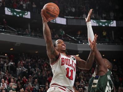 MILWAUKEE, WI - DECEMBER 11:  DeMar DeRozan #11 of the Chicago Bulls goes to the basket during the game   on December 11, 2023 at the Fiserv Forum Center in Milwaukee, Wisconsin. NOTE TO USER: User expressly acknowledges and agrees that, by downloading and or using this Photograph, user is consenting to the terms and conditions of the Getty Images License Agreement. Mandatory Copyright Notice: Copyright 2023 NBAE (Photo by Gary Dineen/NBAE via Getty Images).