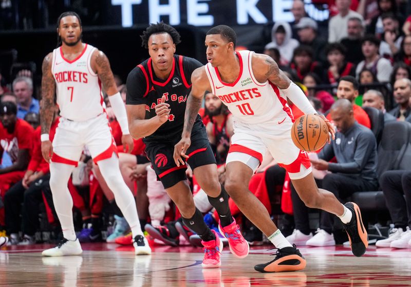 TORONTO, ON - FEBRUARY 9: Jabari Smith #10 of the Houston Rockets dribbles against Scottie Barnes #4 of the Toronto Raptors during the first half of their basketball game at the Scotiabank Arena on February 9, 2024 in Toronto, Ontario, Canada. NOTE TO USER: User expressly acknowledges and agrees that, by downloading and/or using this Photograph, user is consenting to the terms and conditions of the Getty Images License Agreement. (Photo by Mark Blinch/Getty Images)