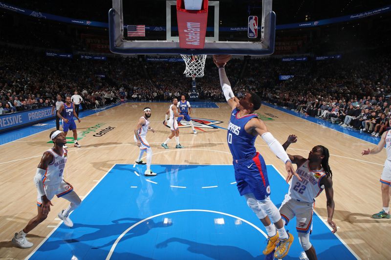 OKLAHOMA CITY, OK - FEBRUARY 22: Russell Westbrook #0 of the LA Clippers drives to the basket during the game against the Oklahoma City Thunder on February 22SF, 2024 at Paycom Arena in Oklahoma City, Oklahoma. NOTE TO USER: User expressly acknowledges and agrees that, by downloading and or using this photograph, User is consenting to the terms and conditions of the Getty Images License Agreement. Mandatory Copyright Notice: Copyright 2024 NBAE (Photo by Zach Beeker/NBAE via Getty Images)