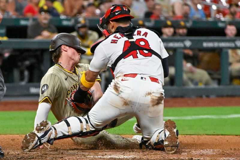 Aug 26, 2024; St. Louis, Missouri, USA;  St. Louis Cardinals catcher Ivan Herrera (48) tags out San Diego Padres pinch runner Bryce Johnson (27) during the eighth inning at Busch Stadium. Mandatory Credit: Jeff Curry-USA TODAY Sports