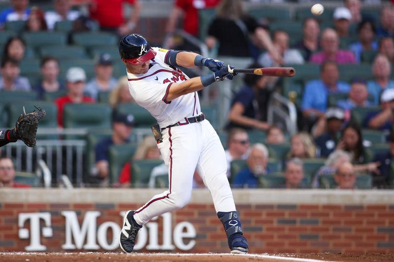 May 14, 2025; Atlanta, Georgia, USA; Atlanta Braves right fielder Stuart Fairchild (17) hits an RBI double against the Washington Nationals in the third inning at Truist Park. Mandatory Credit: Brett Davis-Imagn Images