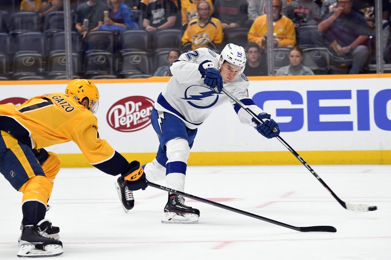 Sep 27, 2023; Nashville, Tennessee, USA; Tampa Bay Lightning forward Maxim Groshev (52) shoots during the second period against the Nashville Predators at Bridgestone Arena. Mandatory Credit: Christopher Hanewinckel-USA TODAY Sports