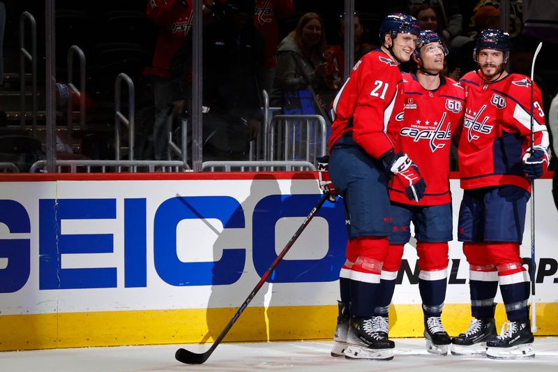 Oct 5, 2024; Washington, District of Columbia, USA; Washington Capitals center Aliaksei Protas (21) celebrates with teammates after scoring a goal against the Boston Bruins in the first period at Capital One Arena. Mandatory Credit: Geoff Burke-Imagn Images