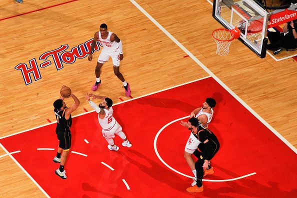 HOUSTON, TX - DECEMBER 27:   Fred VanVleet #5 of the Houston Rockets plays defense against Devin Booker #1 of the Phoenix Suns on December 27, 2023 at the Toyota Center in Houston, Texas. NOTE TO USER: User expressly acknowledges and agrees that, by downloading and or using this photograph, User is consenting to the terms and conditions of the Getty Images License Agreement. Mandatory Copyright Notice: Copyright 2023 NBAE (Photo by Logan Riely/NBAE via Getty Images)