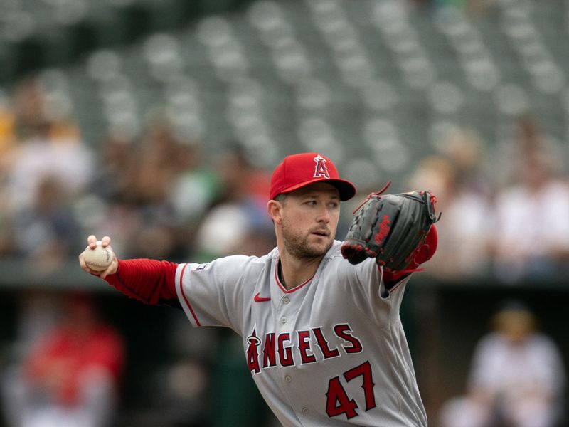 Sep 2, 2023; Oakland, California, USA; Los Angeles Angels starting pitcher Griffin Canning (47) delivers a pitch against the Oakland Athletics during the second inning at Oakland-Alameda County Coliseum. Mandatory Credit: D. Ross Cameron-USA TODAY Sports