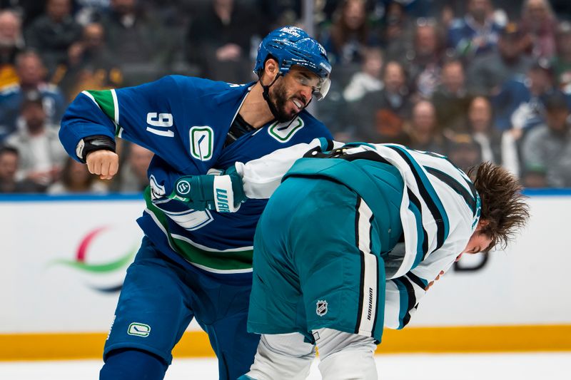 Jan 27, 2026; Vancouver, British Columbia, CAN; Vancouver Canucks forward Evander Kane (91) fights with San Jose Sharks defenseman Timothy Liljegren (37) in the second period at Rogers Arena. Mandatory Credit: Bob Frid-Imagn Images
