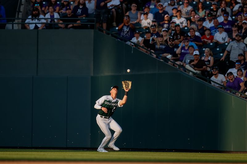 Jul 15, 2023; Denver, Colorado, USA; Colorado Rockies right fielder Nolan Jones (22) makes a catch in the sixth inning against the New York Yankees at Coors Field. Mandatory Credit: Isaiah J. Downing-USA TODAY Sports