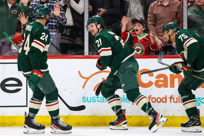 Apr 3, 2023; Saint Paul, Minnesota, USA; Minnesota Wild right wing Brandon Duhaime (21) celebrates his goal against the Vegas Golden Knights during the second period at Xcel Energy Center. Mandatory Credit: Matt Krohn-USA TODAY Sports