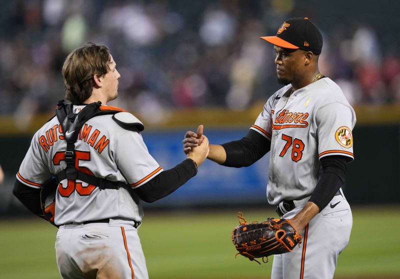 Sep 3, 2023; Phoenix, Arizona, USA; Baltimore Orioles relief pitcher Yennier Cano (78) and celebrate after defeating the Arizona Diamondbacks at Chase Field. Mandatory Credit: Joe Camporeale-USA TODAY Sports