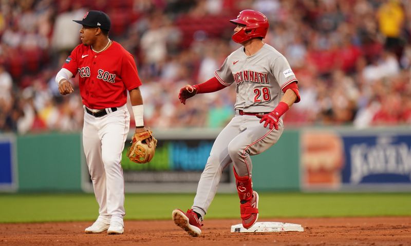 Jun 1, 2023; Boston, Massachusetts, USA; Cincinnati Reds shortstop Kevin Newman (28) hits a double and drives in a run against the Boston Red Sox in the third inning at Fenway Park. Mandatory Credit: David Butler II-USA TODAY Sports