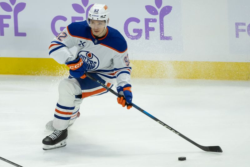 Nov 19, 2024; Ottawa, Ontario, CAN; Edmonton Oilers right wing Vasily Podkolzin (92) skates with the puck in the third period against the Ottawa Senators at the Canadian Tire Centre. Mandatory Credit: Marc DesRosiers-Imagn Images