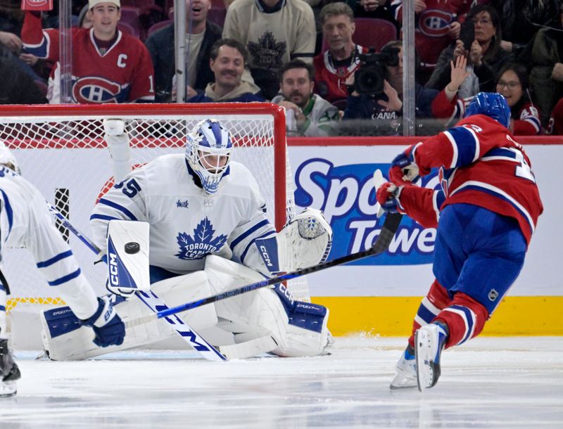 Nov 22, 2025; Montreal, Quebec, CAN; Toronto Maple Leafs goalie Dennis Hildeby (35) makes a save against Montreal Canadiens forward Cole Caufield (13) during the third period at the Bell Centre. Mandatory Credit: Eric Bolte-Imagn Images
