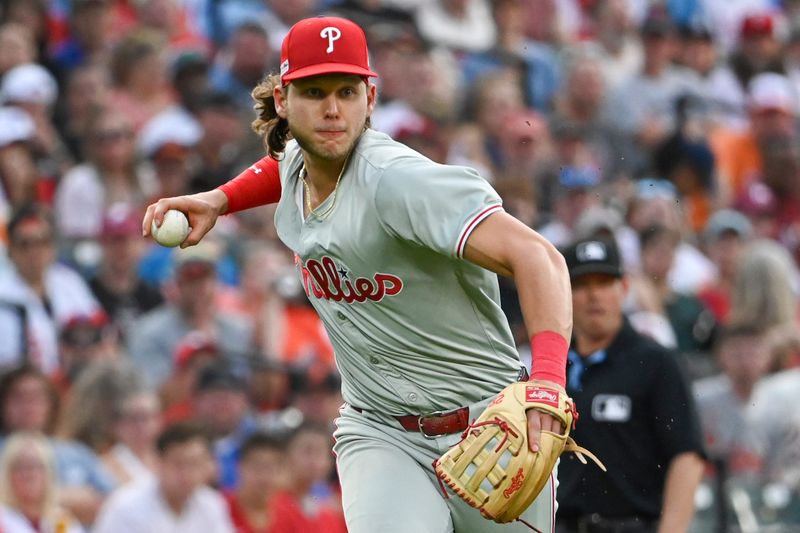 Jun 14, 2024; Baltimore, Maryland, USA;  Philadelphia Phillies third baseman Alec Bohm (28) throws to first base after fielding a second inning ground ball ]against the Baltimore Orioles at Oriole Park at Camden Yards. Mandatory Credit: Tommy Gilligan-USA TODAY Sports