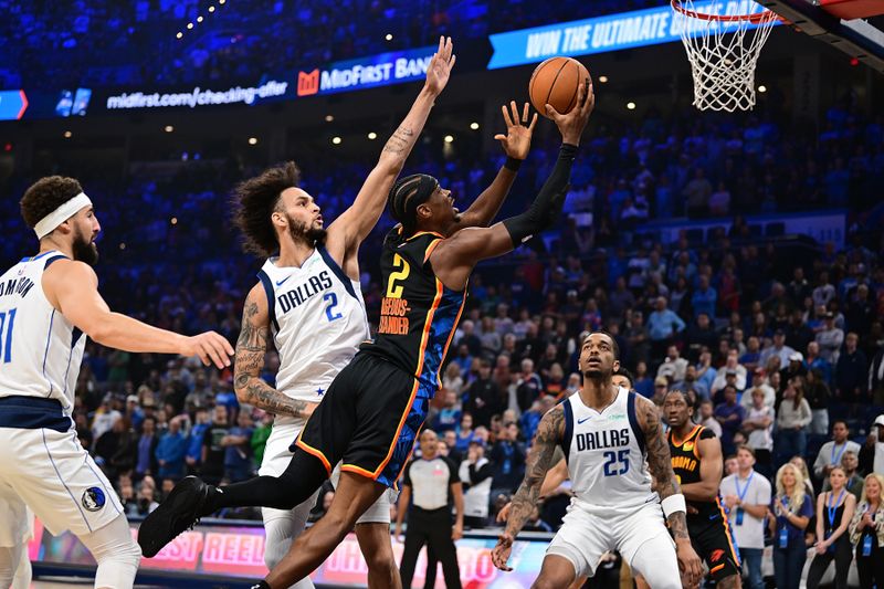 OKLAHOMA CITY, OKLAHOMA - NOVEMBER 17: Shai Gilgeous-Alexander #2 of the Oklahoma City Thunder attacks the rim in front of Dereck Lively II #2 of the Dallas Mavericks during the first half at Paycom Center on November 17, 2024 in Oklahoma City, Oklahoma. NOTE TO USER: User expressly acknowledges and agrees that, by downloading and or using this photograph, User is consenting to the terms and conditions of the Getty Images License Agreement. (Photo by Joshua Gateley/Getty Images)