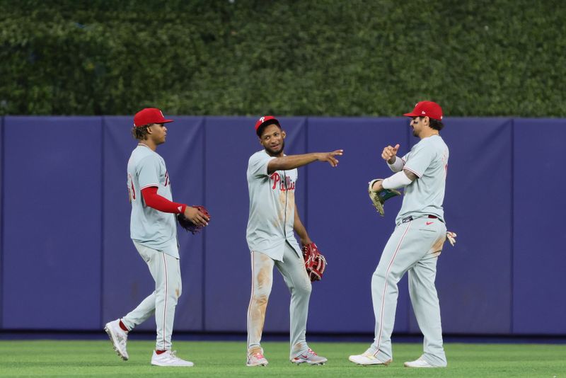 May 10, 2024; Miami, Florida, USA; Philadelphia Phillies center fielder Johan Rojas (18) celebrates with left fielder Cristian Pache (19) and right fielder Nick Castellanos (8) after the game against the Miami Marlins at loanDepot Park. Mandatory Credit: Sam Navarro-USA TODAY Sports