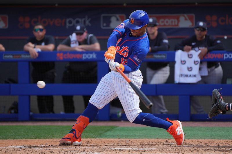 Mar 5, 2024; Port St. Lucie, Florida, USA;  New York Mets shortstop Francisco Lindor (12) hits a double to right field in the third inning against the New York Yankees at Clover Park. Mandatory Credit: Jim Rassol-USA TODAY Sports