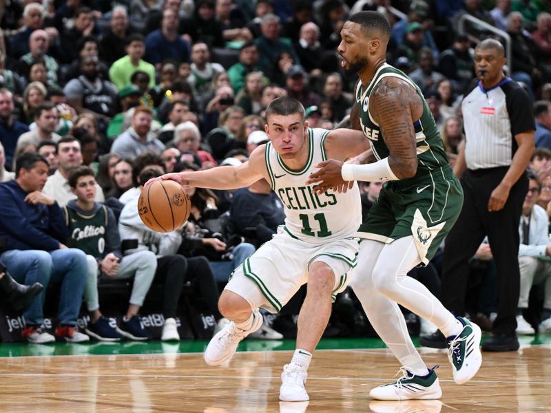 BOSTON, MASSACHUSETTS - OCTOBER 28: Payton Pritchard #11 of the Boston Celtics drives to the basket against Damian Lillard #0 of the Milwaukee Bucks during the second half at the TD Garden on October 28, 2024 in Boston, Massachusetts. NOTE TO USER: User expressly acknowledges and agrees that, by downloading and or using this photograph, User is consenting to the terms and conditions of the Getty Images License Agreement. (Photo by Brian Fluharty/Getty Images)