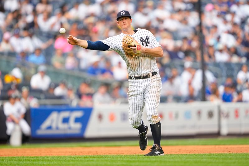 Jul 8, 2023; Bronx, New York, USA; New York Yankees third baseman DJ LeMahieu (26) throws out Chicago Cubs left fielder Ian Happ (not pictured) during the eighth inning at Yankee Stadium. Mandatory Credit: Gregory Fisher-USA TODAY Sports