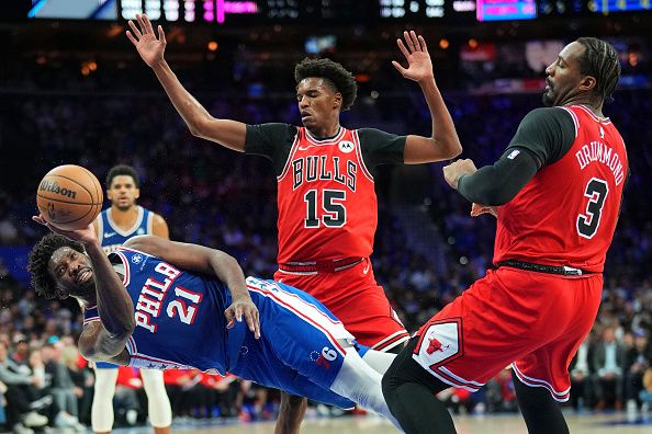 PHILADELPHIA, PENNSYLVANIA - JANUARY 2: Joel Embiid #21 of the Philadelphia 76ers shoots the ball after getting fouled by Julian Phillips #15 of the Chicago Bulls in the third quarter at the Wells Fargo Center on January 2, 2024 in Philadelphia, Pennsylvania. The 76ers defeated the Bulls 110-97. NOTE TO USER: User expressly acknowledges and agrees that, by downloading and or using this photograph, User is consenting to the terms and conditions of the Getty Images License Agreement. (Photo by Mitchell Leff/Getty Images)