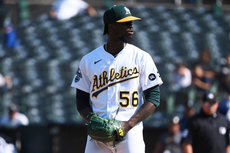Sep 20, 2023; Oakland, California, USA; Oakland Athletics relief pitcher Dany Jimenez (56) looks on against the Seattle Mariners during the ninth inning at Oakland-Alameda County Coliseum. Mandatory Credit: Kelley L Cox-USA TODAY Sports