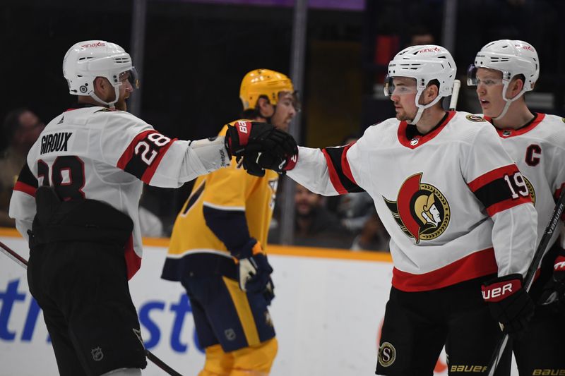 Feb 27, 2024; Nashville, Tennessee, USA; Ottawa Senators right wing Drake Batherson (19) is congratulated by right wing Claude Giroux (28) after a goal during the first period against the Nashville Predators at Bridgestone Arena. Mandatory Credit: Christopher Hanewinckel-USA TODAY Sports