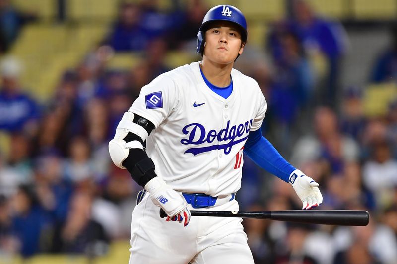 Apr 3, 2024; Los Angeles, California, USA; Los Angeles Dodgers designated hitter Shohei Ohtani (17) reacts after striking out against the San Francisco Giants during the first inning at Dodger Stadium. Mandatory Credit: Gary A. Vasquez-USA TODAY Sports