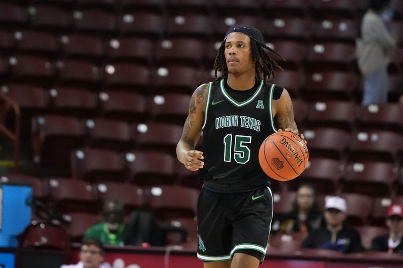 Nov 19, 2023; Charleston, SC, USA; North Texas Mean Green guard Rubin Jones (15) brings the ball up court in the second half against the Towson Tigers at TD Arena. Mandatory Credit: David Yeazell-USA TODAY Sports