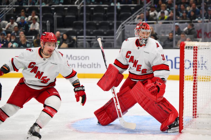 Oct 26, 2024; Seattle, Washington, USA; Carolina Hurricanes goaltender Frederik Andersen (31) defends the goal against the Seattle Kraken during the third period at Climate Pledge Arena. Mandatory Credit: Steven Bisig-Imagn Images