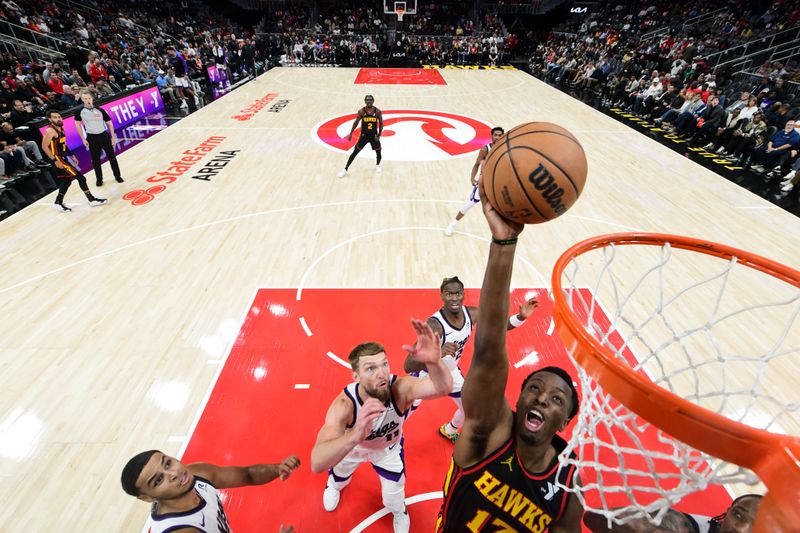 ATLANTA, GA - NOVEMBER 1: Onyeka Okongwu #17 of the Atlanta Hawks handles the ball during the game against the Sacramento Kings on November 1, 2024 at State Farm Arena in Atlanta, Georgia.  NOTE TO USER: User expressly acknowledges and agrees that, by downloading and/or using this Photograph, user is consenting to the terms and conditions of the Getty Images License Agreement. Mandatory Copyright Notice: Copyright 2024 NBAE (Photo by Adam Hagy/NBAE via Getty Images)