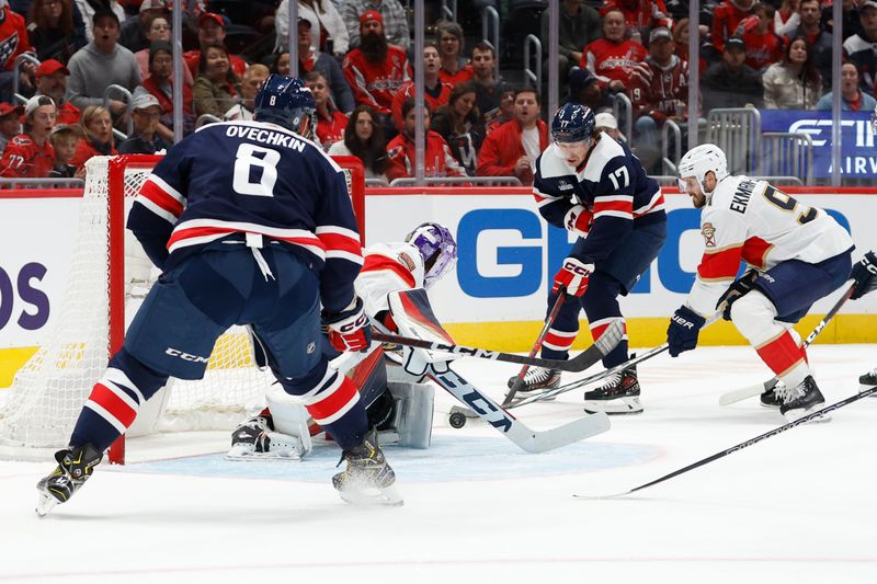 Nov 8, 2023; Washington, District of Columbia, USA; Washington Capitals center Dylan Strome (17) passes the puck to Washington Capitals left wing Alex Ovechkin (8) in front of Florida Panthers goaltender Sergei Bobrovsky (72) as Panthers defenseman Oliver Ekman-Larsson (91) defends in the first period at Capital One Arena. Mandatory Credit: Geoff Burke-USA TODAY Sports