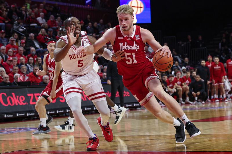 Jan 17, 2024; Piscataway, New Jersey, USA; Nebraska Cornhuskers forward Rienk Mast (51) drives to the basket against Rutgers Scarlet Knights forward Aundre Hyatt (5) during the first half at Jersey Mike's Arena. Mandatory Credit: Vincent Carchietta-USA TODAY Sports